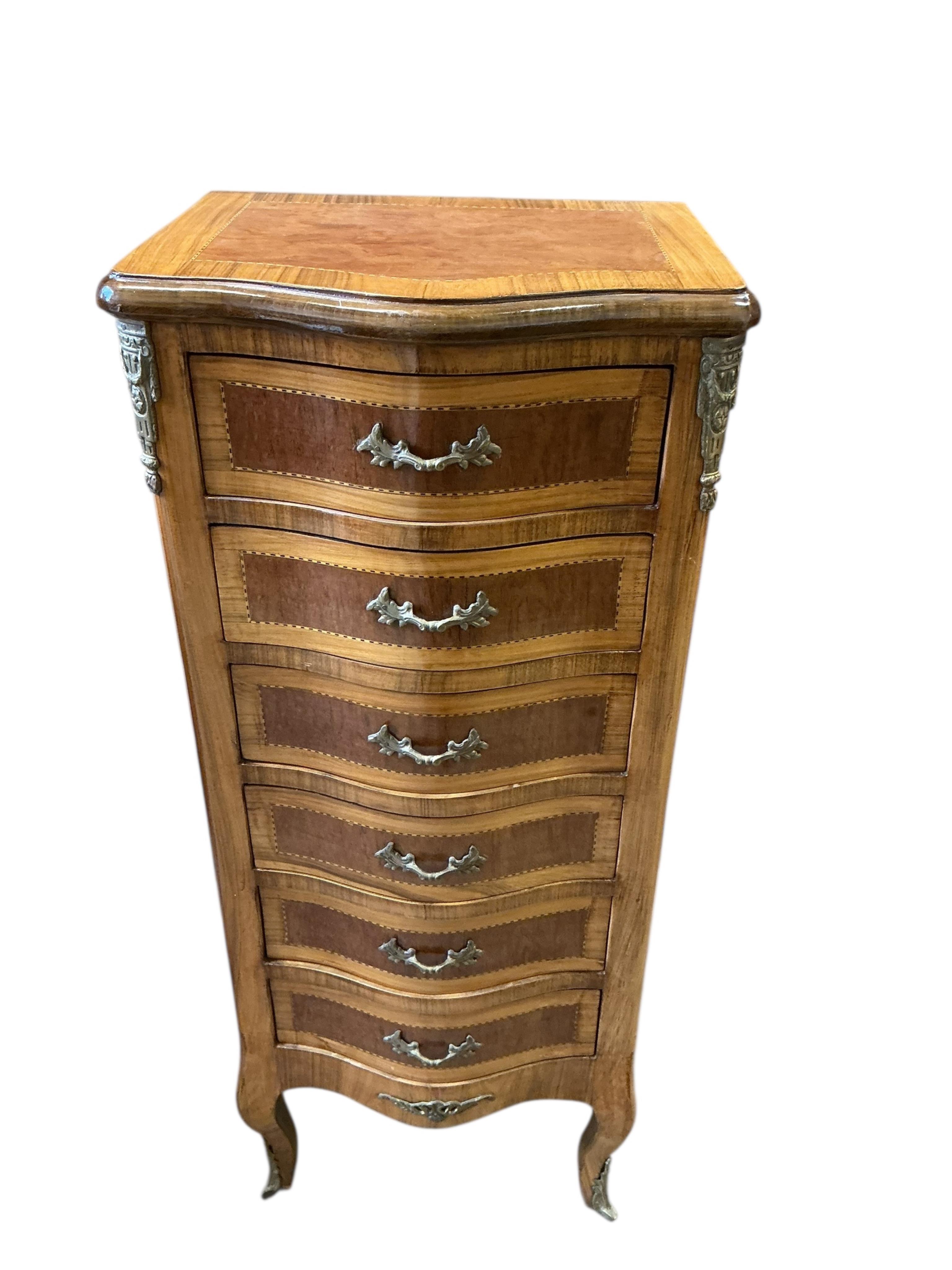 A pair of reproduction gilt metal mounted kingwood banded serpentine narrow seven drawer chests, width 45cm, depth 35cm, height 108cm